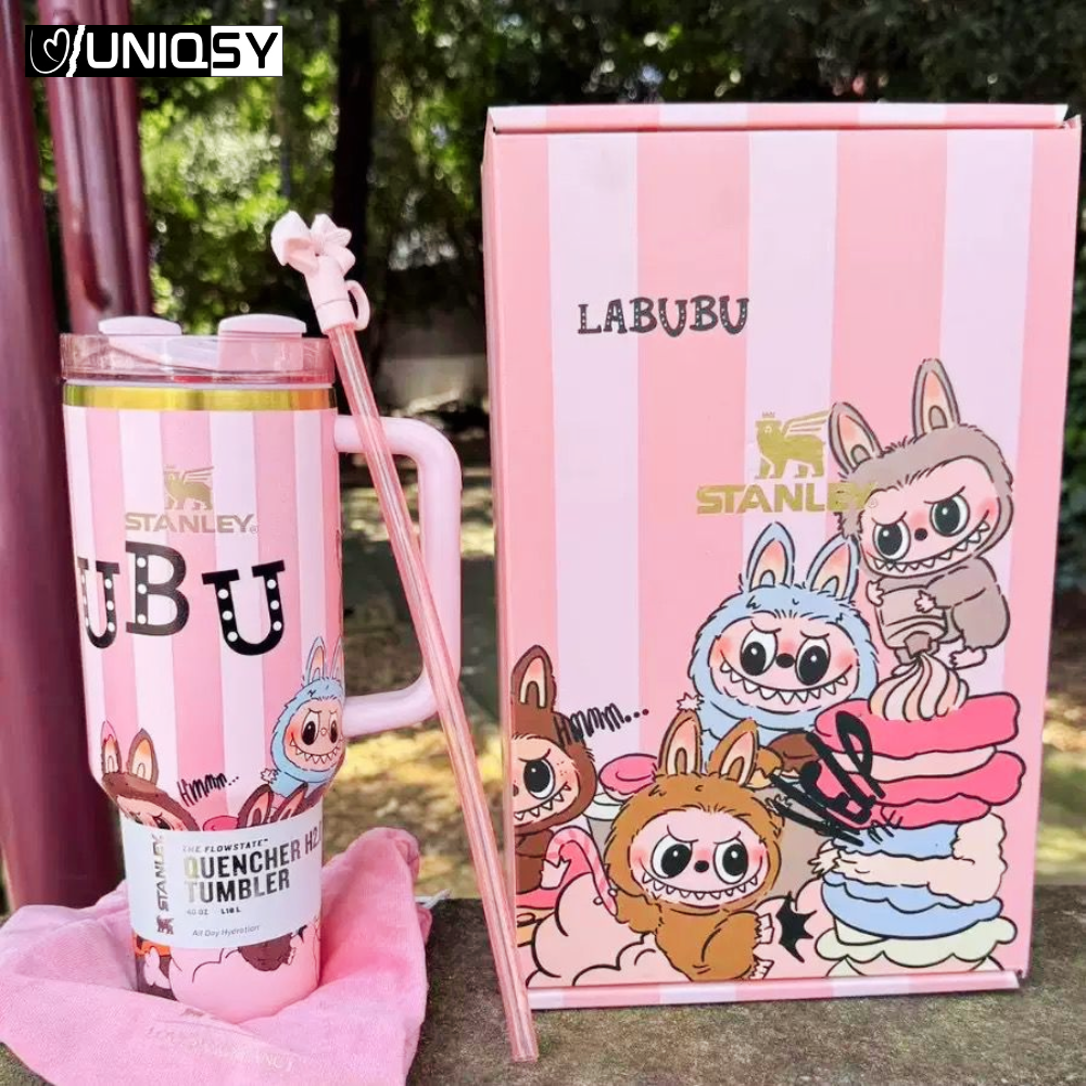 Person holding Stanley Labubu Pink Quencher Tumbler with straw – stylish limited edition drinkware for everyday use