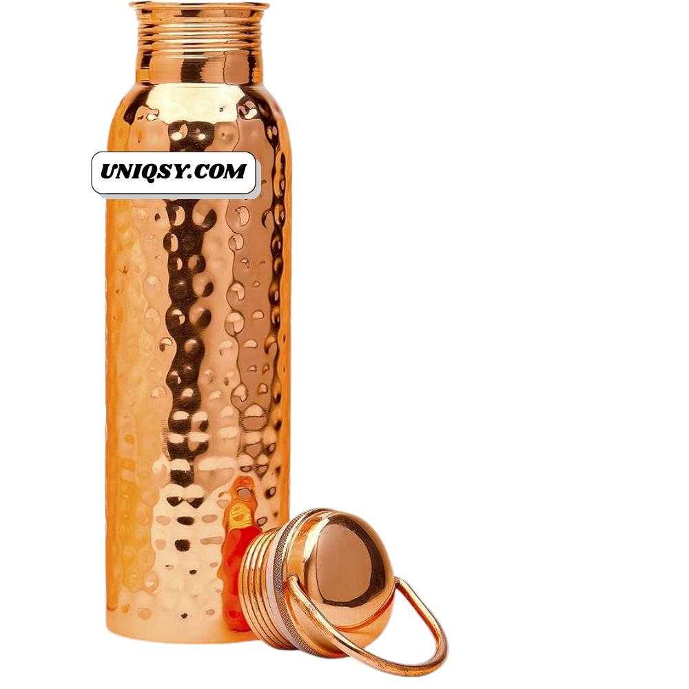Side angle of handcrafted hammered copper bottle – textured finish for improved grip and traditional charm.