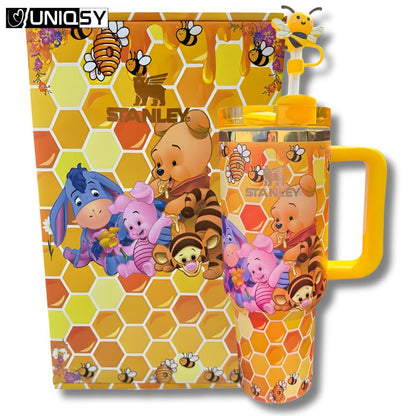 Close-up of Stanley Yellow Bee Bear insulated cup showing detailed bear and bee print.