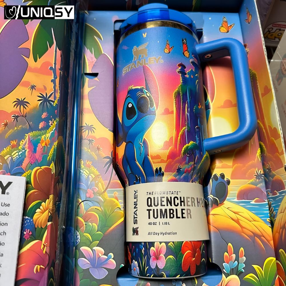 Stanley Stitch Sapphire Blue Tumbler lid and reusable straw detail showing splash-proof design and handle grip.