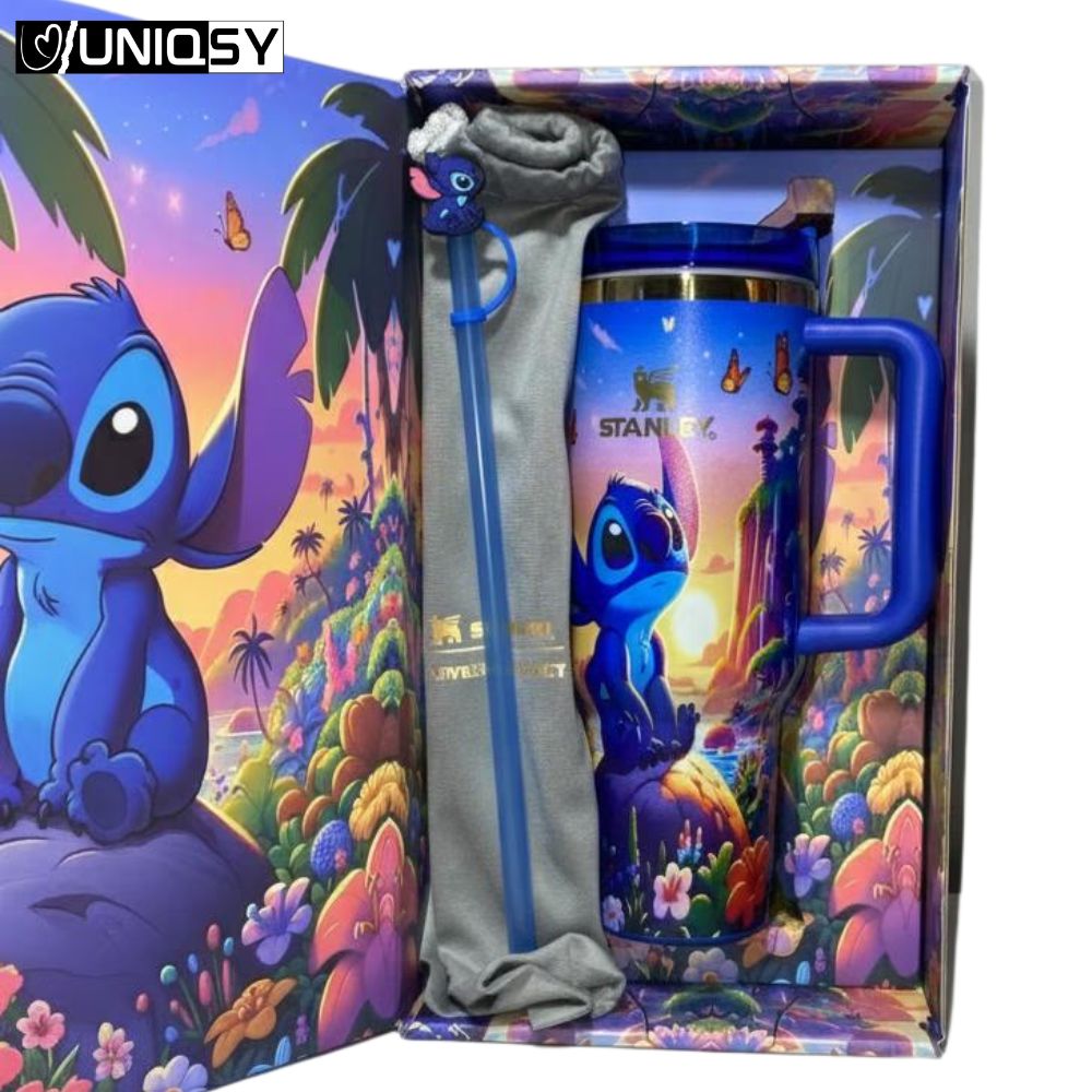 Side angle of the Stanley Stitch Sapphire Blue 40 OZ Quencher Tumbler with sturdy handle and tropical design.